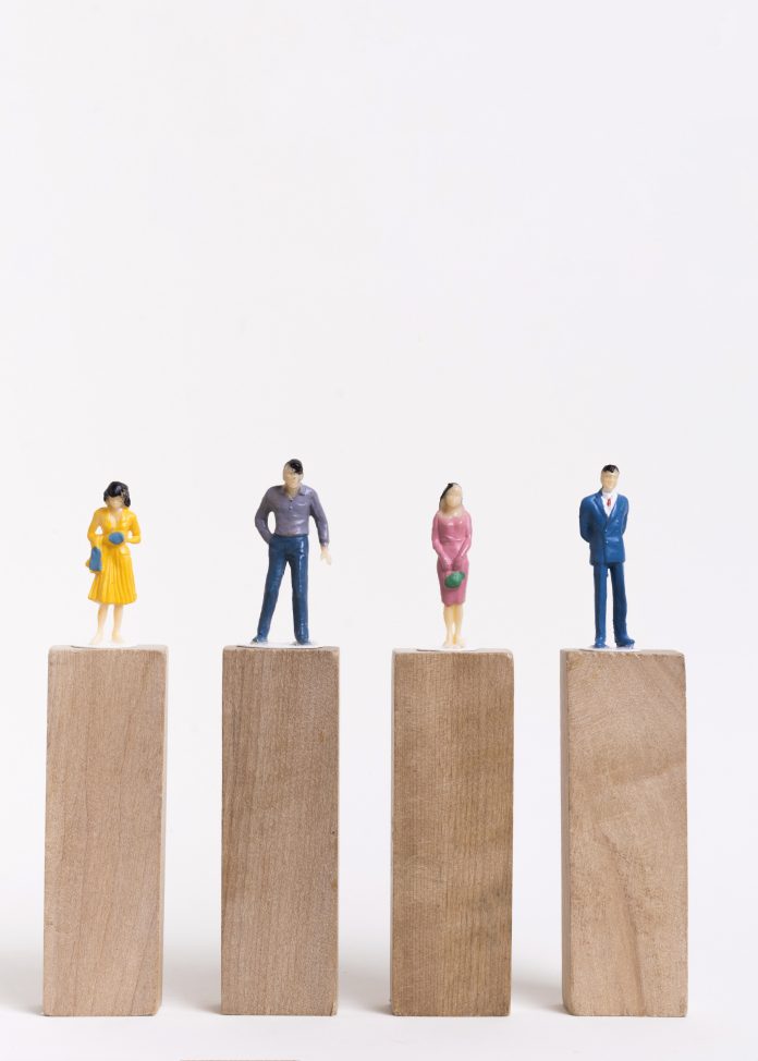 business-man-woman-sitting-equal-pieces-wooden