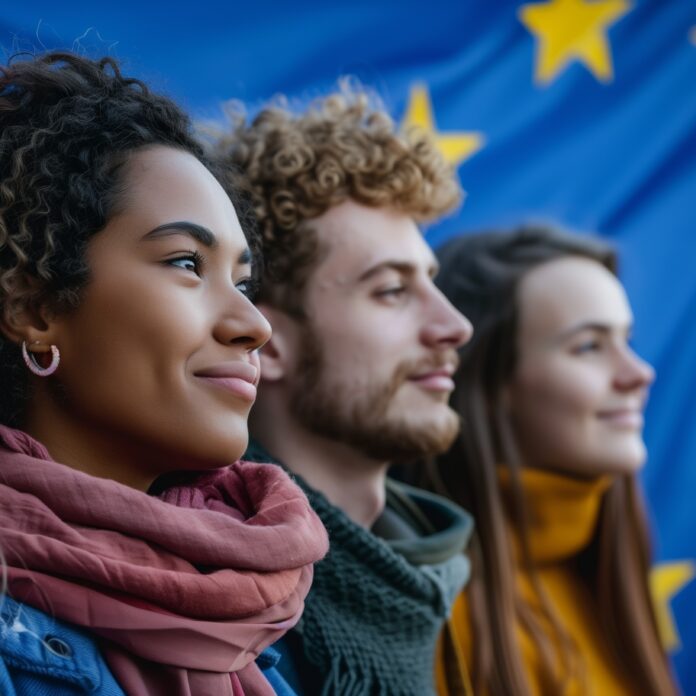 four-young-adults-diverse-smiling-stand-confidently-against-backdrop-european-flag-symb